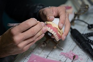 Lab tech carving dentures